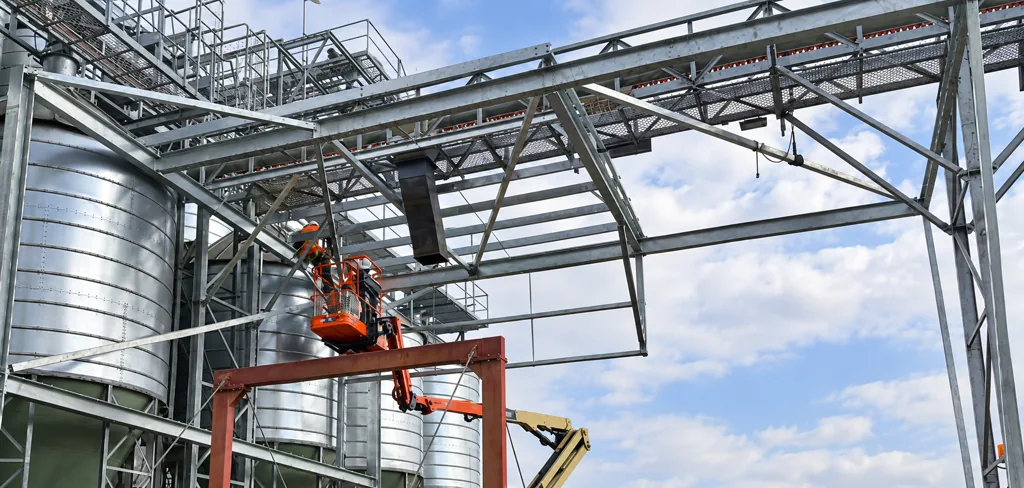 Structural steel installation around industrial tanks
